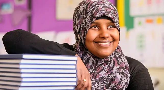 smiling students with books