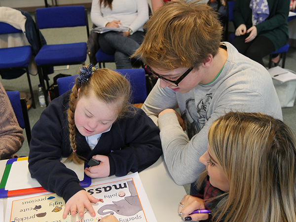 Teacher in training withing with SEN students.
