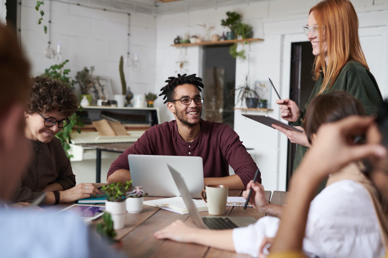 A group of business people making plans. A group of business people making plans.