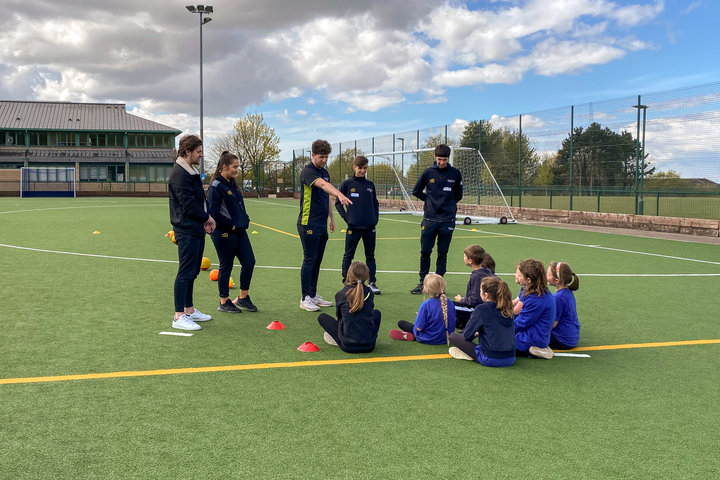 Sport students coaching school children as part of a module Sport students coaching school children as part of a module